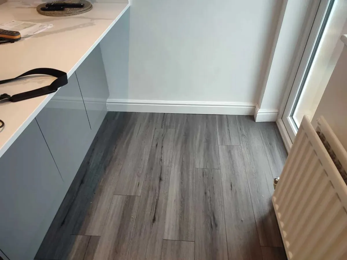 Kitchen with grey laminate floor and no visible damage